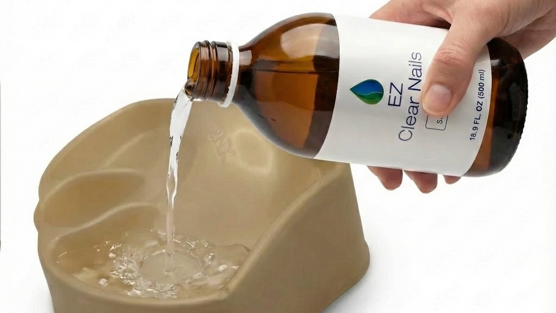 EZ Clear Nails 500ml solution being poured from the amber bottle into the IodinePure foot soak tray