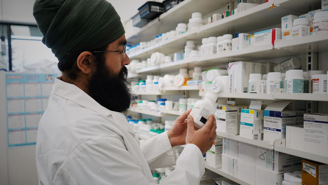 Pharmacist organising shelves in a pharmacy