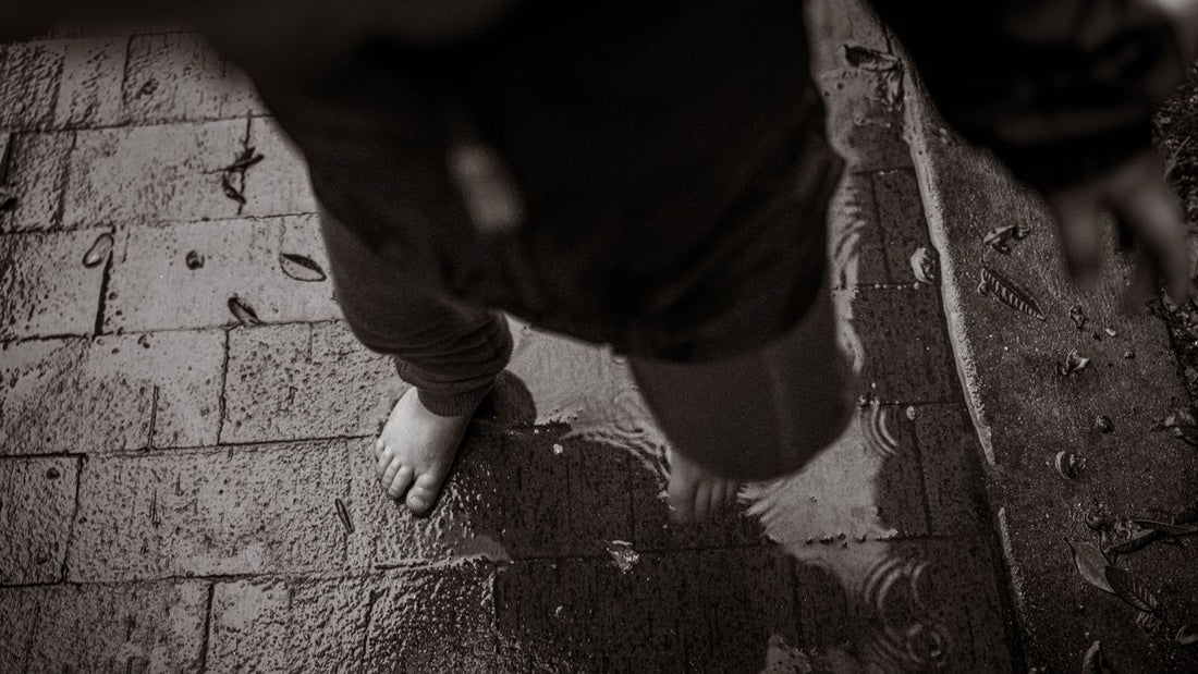 Barefoot on a wet textured surface