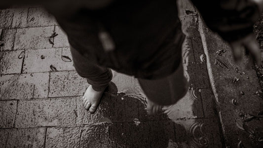 Barefoot on a wet textured surface