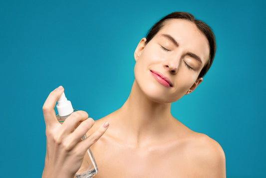 Woman using a facial mist, the everyday routine Tower 28 SOS Spray and EZ Clear Skin both fit into