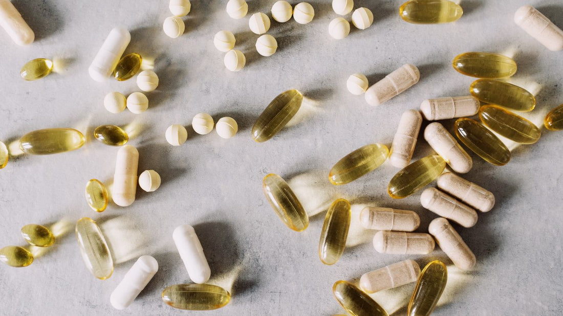 Vitamins and mineral supplements arranged on a marble surface