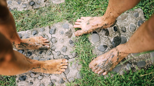Bare feet on a stone path outdoors