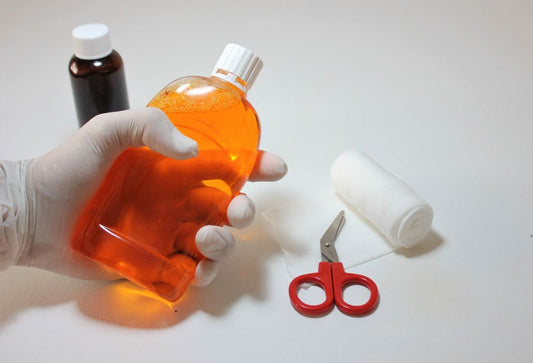 Antiseptic solution bottle with first aid supplies, the brown iodine that stains compared with clear aqueous iodine
