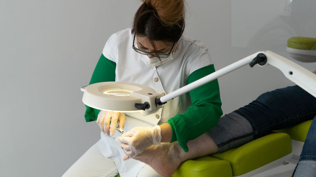 Foot care specialist working with professional equipment