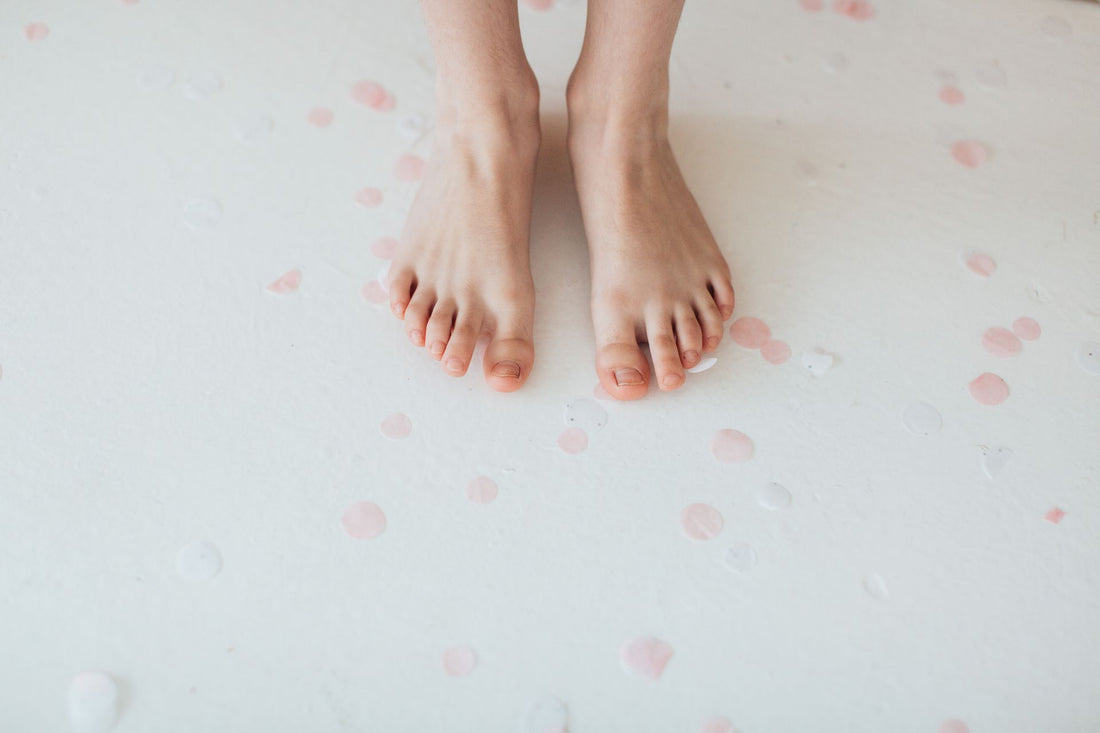 Close-up of bare toenails on a plain pale surface, the everyday view people use to judge a nail change