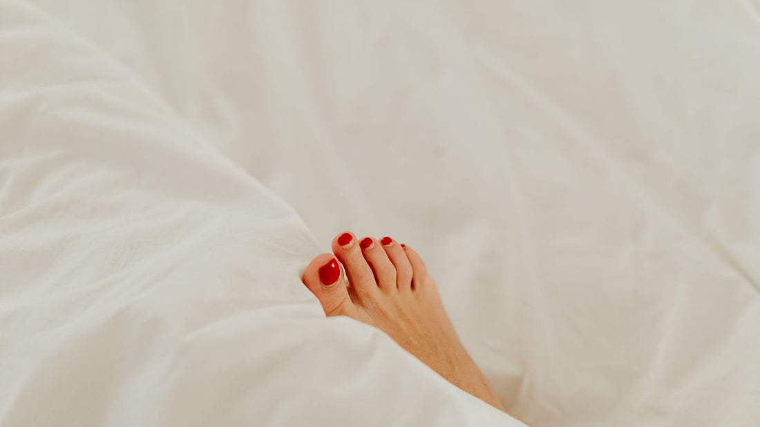 A foot resting under a blanket during recovery