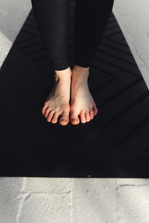 Close-up of a person's bare feet and toenails