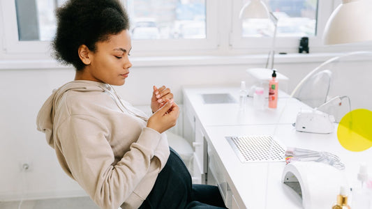 A client being treated at a nail salon table