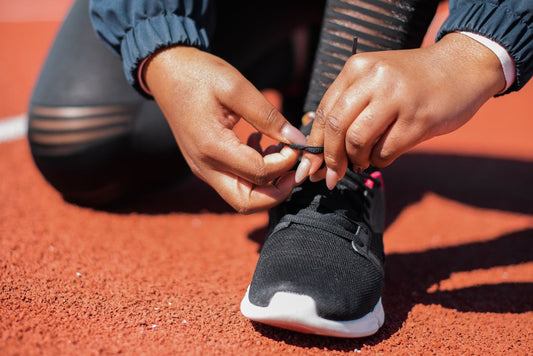 Lacing supportive shoes before a long shift, the footwear choice that matters most for nurses