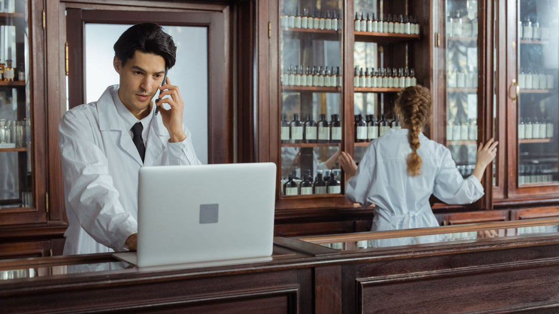 Pharmacists organising medicines behind the counter