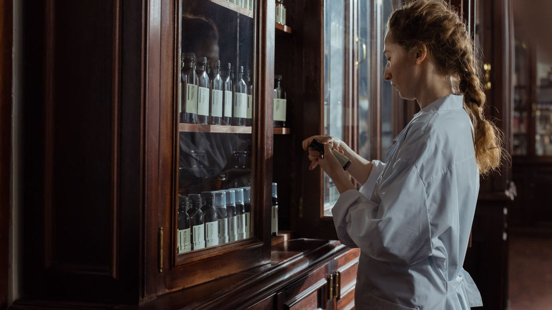 Pharmacist organising boxes on a pharmacy shelf
