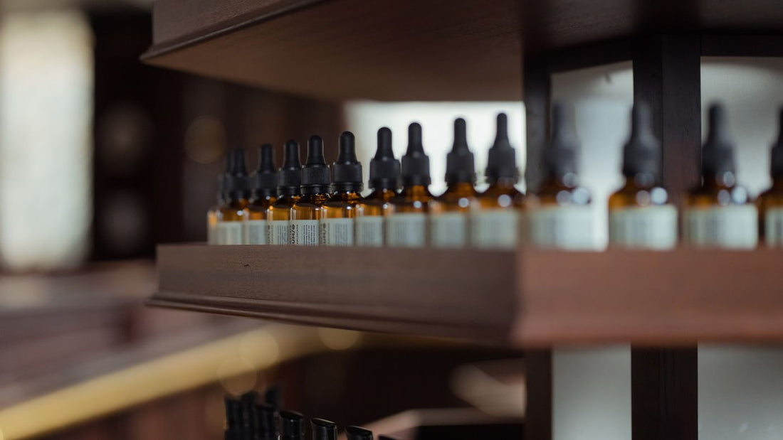 Small dropper bottles arranged on a wooden surface