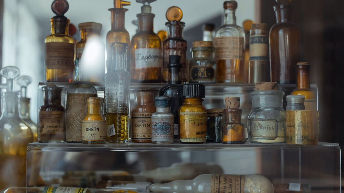 Collection of apothecary bottles on a shelf