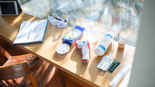 Medical supplies and a clipboard on a sunlit desk