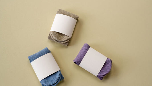 Folded pairs of socks laid out together