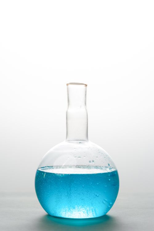 Chemistry laboratory with scientific flasks — comparing types of iodine