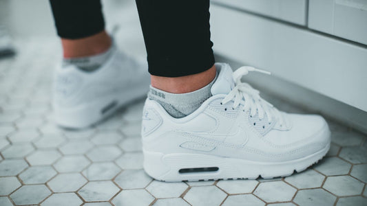 Trainers on a tiled floor