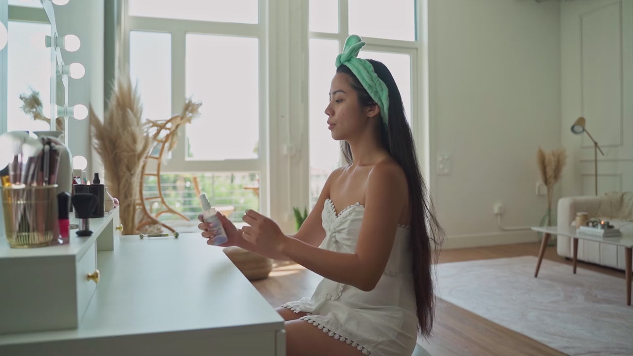 video of model using ez clear skin spraying her face